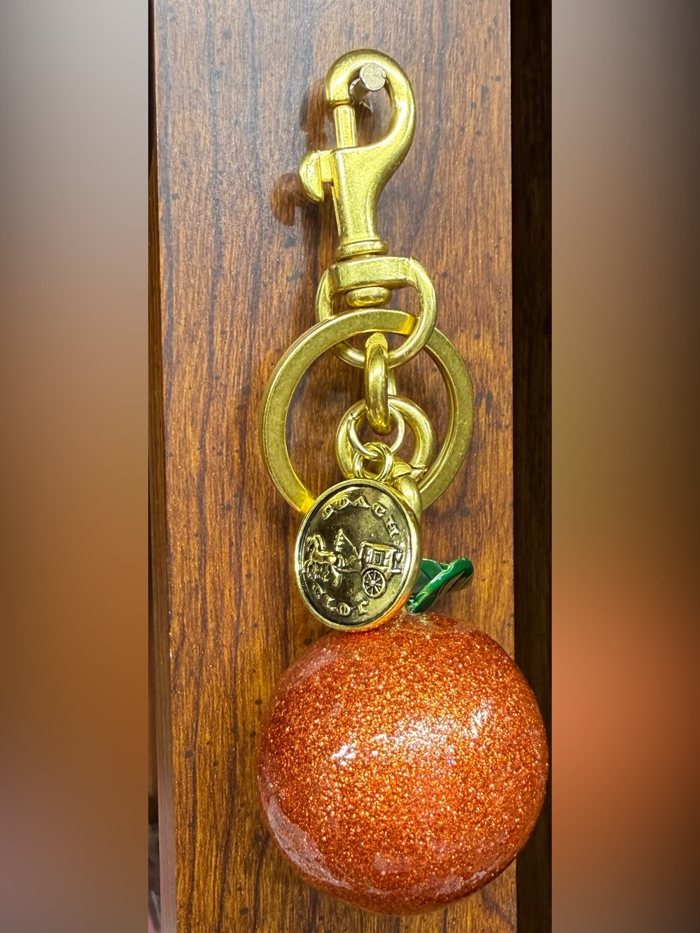 NWOT Coach Gold-Tone Keychain with Glitter Orange Charm